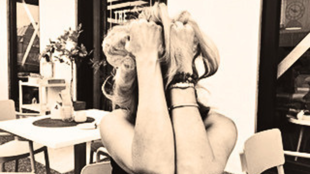 Woman with head in hands