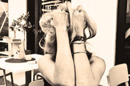 Woman with head in hands